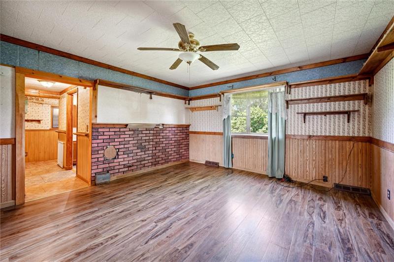 789 Mahoning Road Templeton, PA 16259 - Photo 24 of 41 a view of an empty room with wooden floor and a window