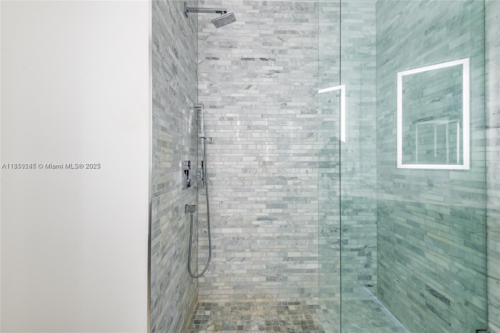 851 Northeast 1st Avenue, Unit 2100 Miami, FL 33132 - Photo 29 of 40 a bathroom with a shower