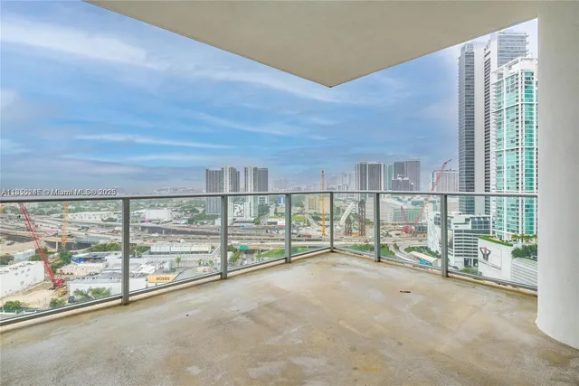 an empty room with sliding door and mountain view