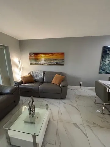 a living room with furniture and a couch