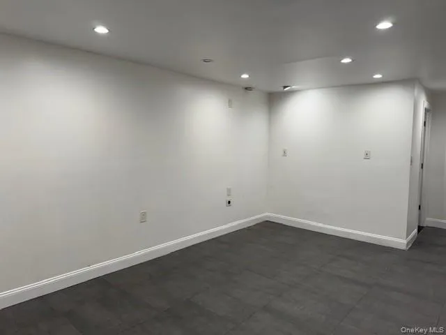 a white toilet sitting next to a bath tub