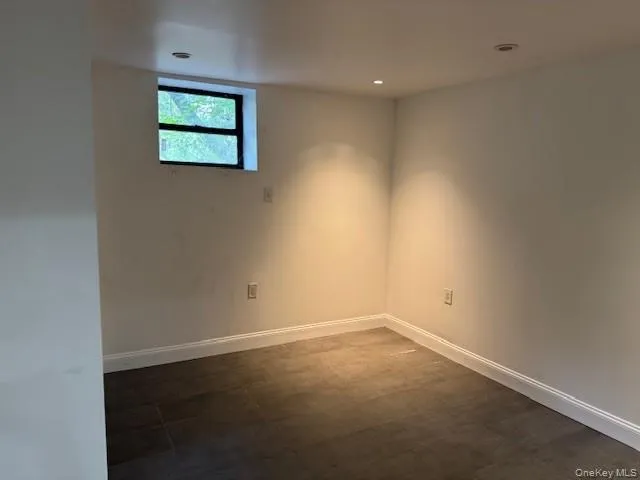 an empty room with a empty space and window