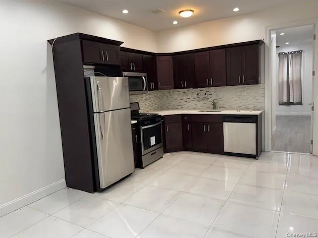 a bathroom with a toilet a sink and bathtub