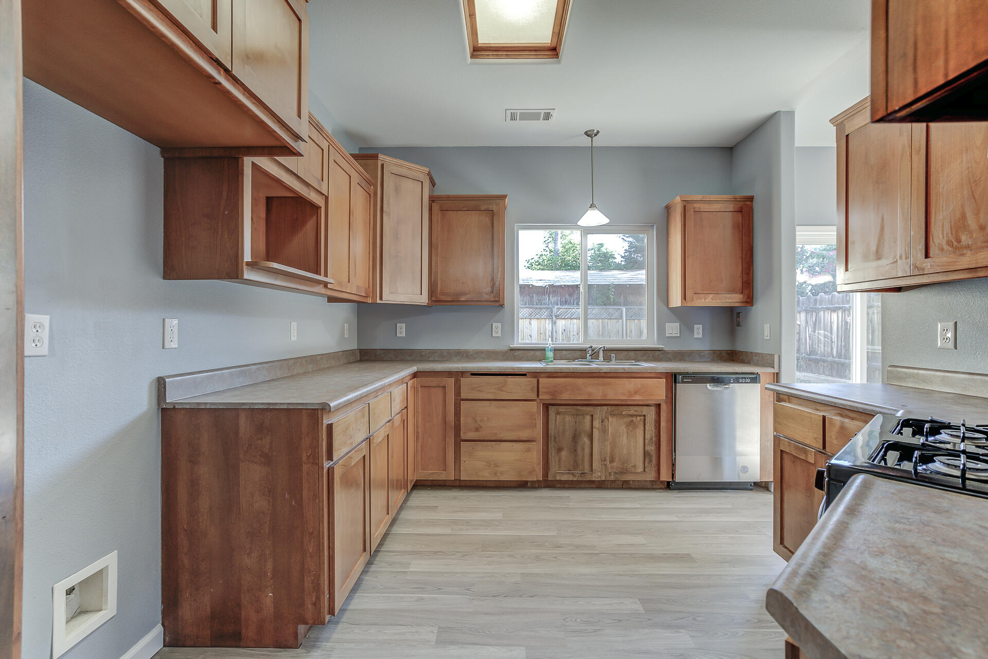 1101 Layton Road Redding, CA 96002 - Photo 11 of 37 a kitchen with stainless steel appliances granite countertop a stove a sink and a microwave