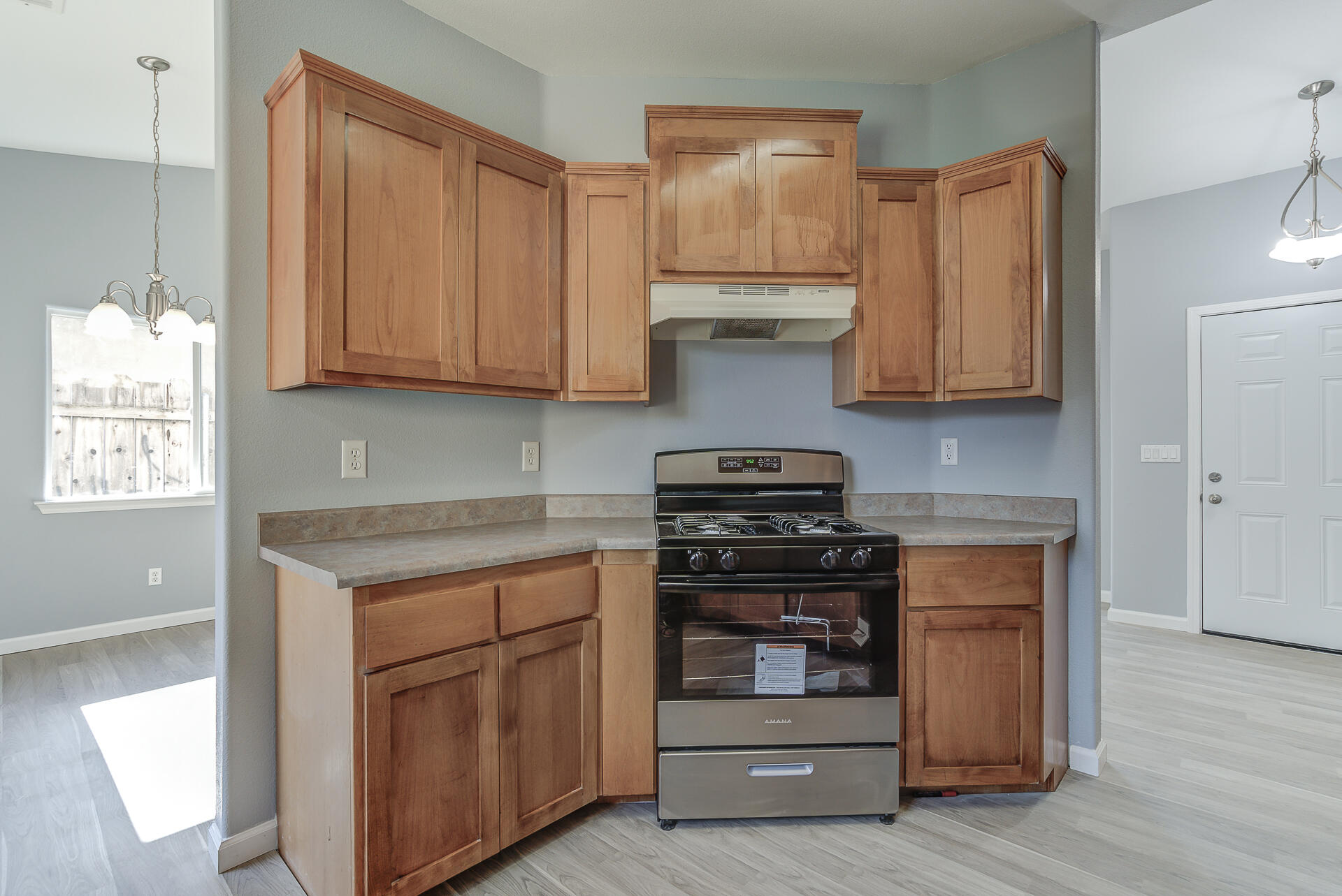 1101 Layton Road Redding, CA 96002 - Photo 14 of 37 a kitchen with stainless steel appliances granite countertop a stove and a refrigerator