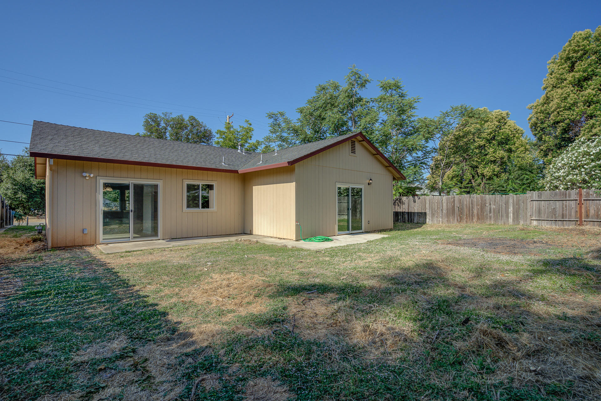 1101 Layton Road Redding, CA 96002 - Photo 31 of 37 a view of a house with yard and a garden
