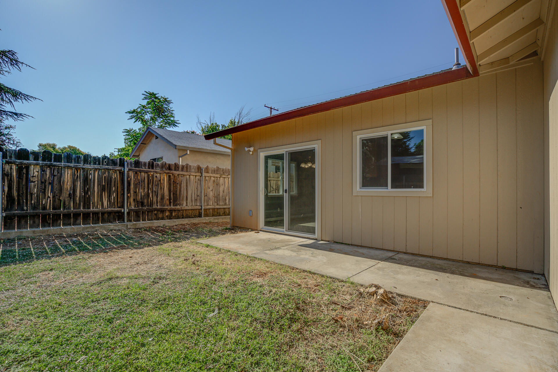 1101 Layton Road Redding, CA 96002 - Photo 33 of 37 a backyard of a house with wooden fence