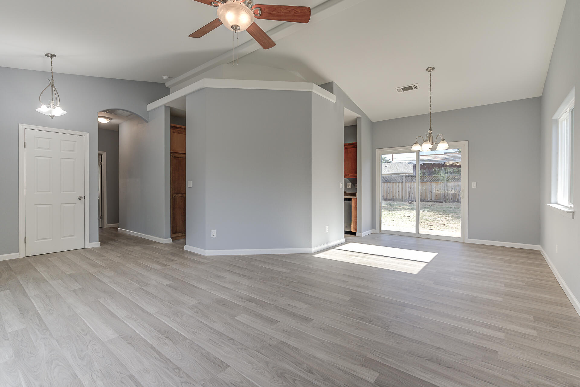 1101 Layton Road Redding, CA 96002 - Photo 6 of 37 a view of an empty room with wooden floor and a window