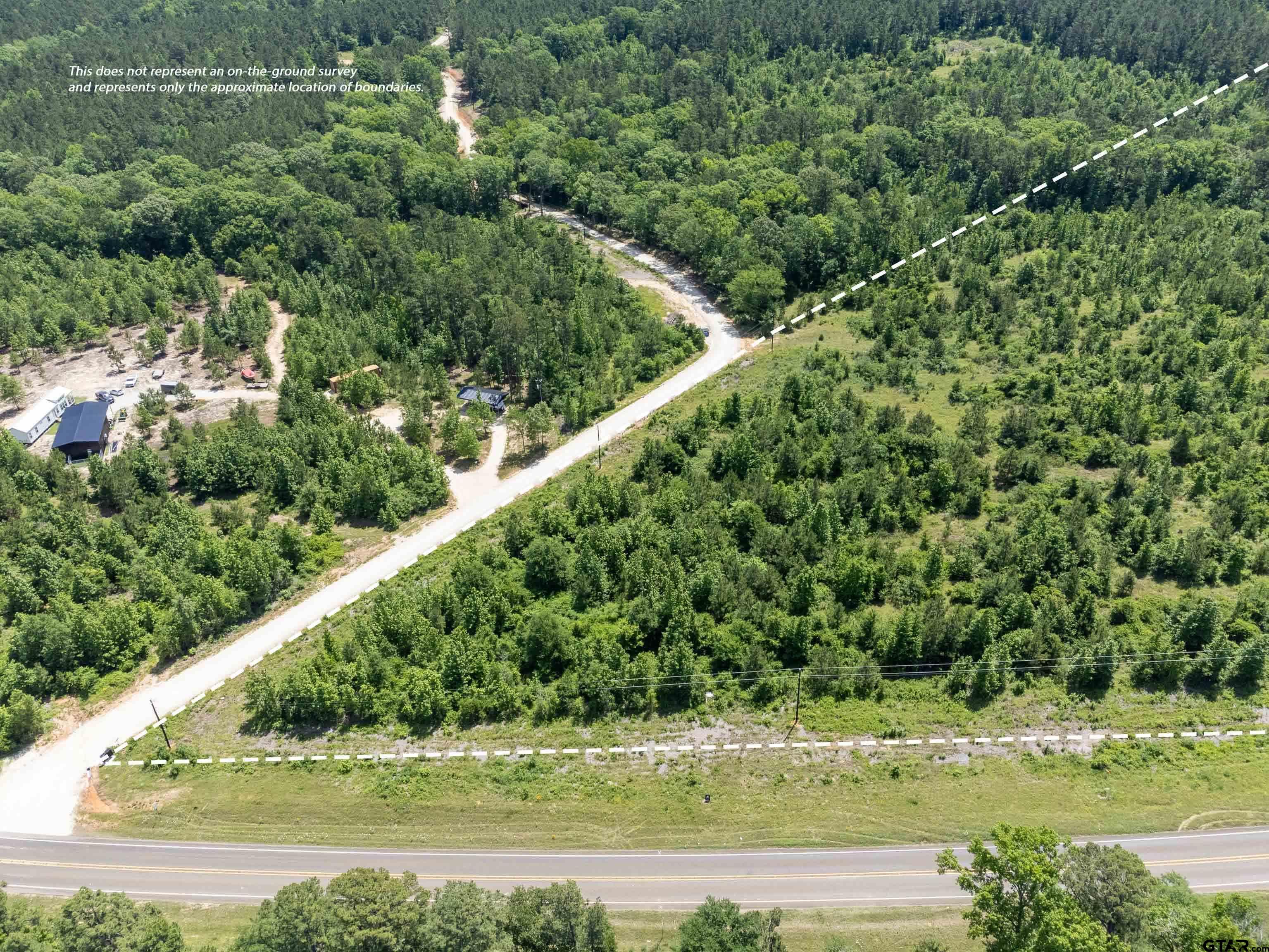 172 George Boulevard Rusk, TX 75785 - Photo 9 of 14 an aerial view of a forest with a yard
