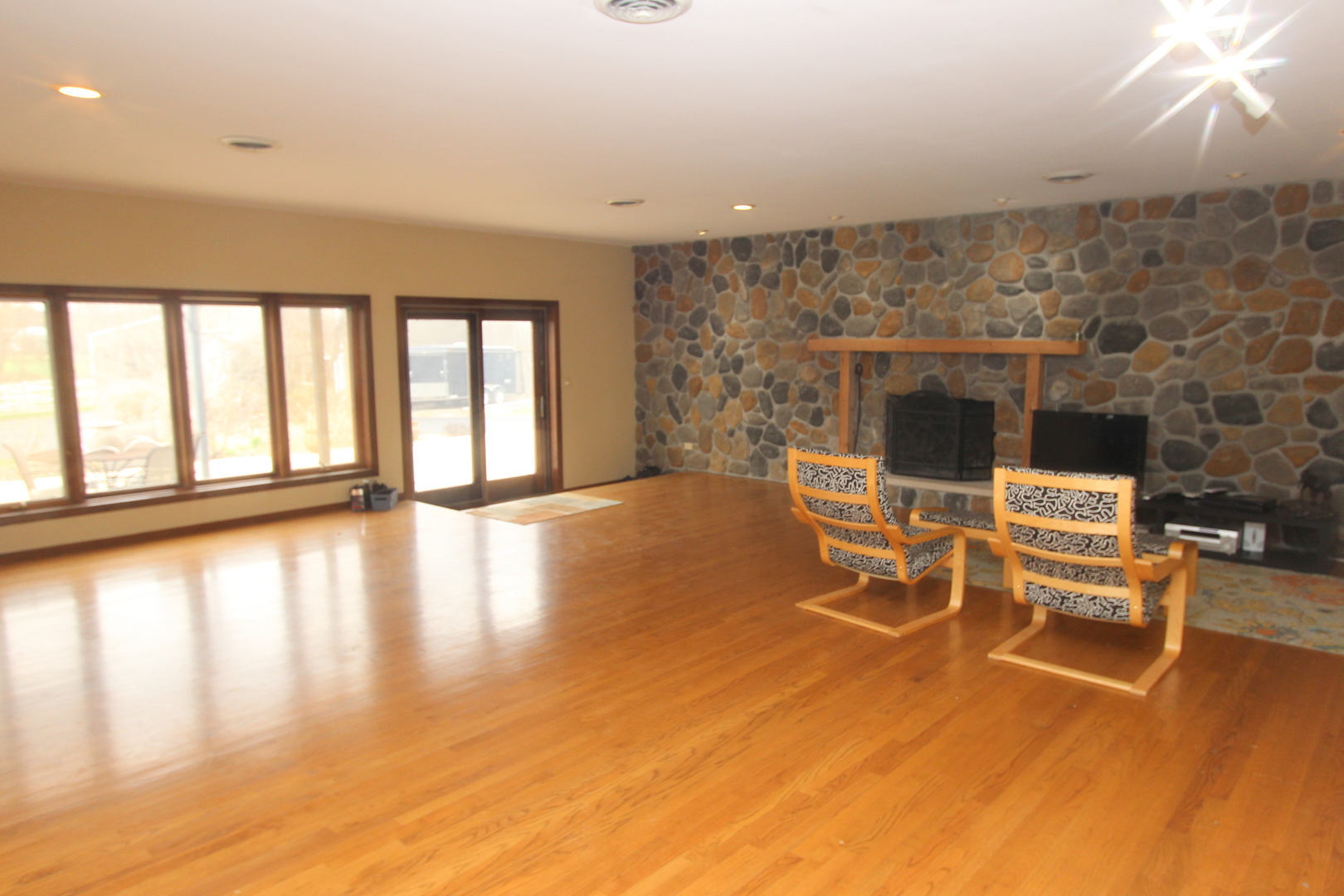 21614 River Road Marengo, IL 60152 - Photo 13 of 45 a living room with fireplace furniture and a large window