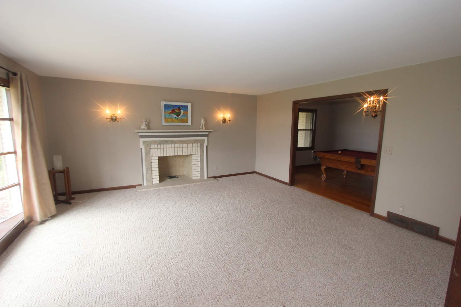 21614 River Road Marengo, IL 60152 - Photo 3 of 45 a view of a livingroom with a fireplace cabinet and windows