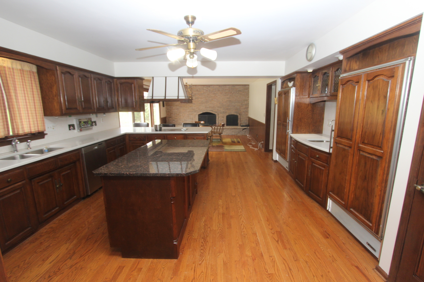 21614 River Road Marengo, IL 60152 - Photo 6 of 45 a kitchen with kitchen island granite countertop a sink appliances cabinets and furniture