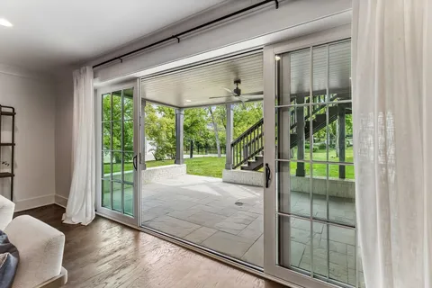 a porch with a glass door