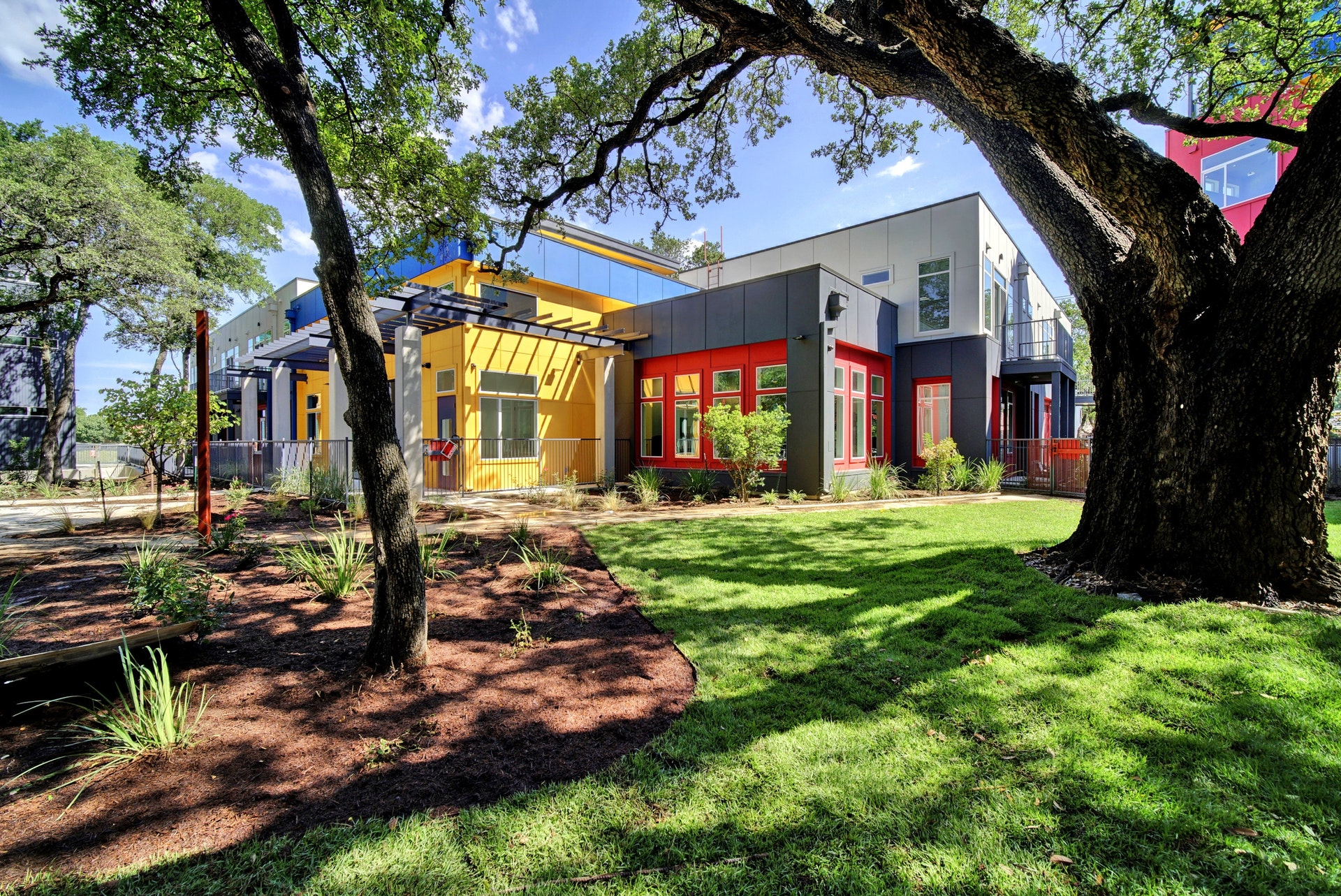 View of front of house featuring board and batten siding and a front yard