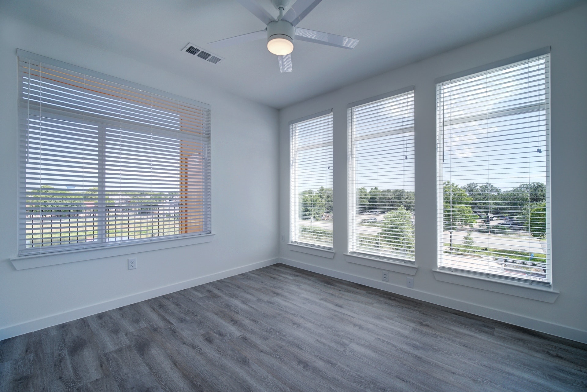 13130 Pond Springs Road, Unit 2203 Austin, TX 78729 - Photo 22 of 32 Spare room with plenty of natural light, dark wood-type flooring, and a ceiling fan