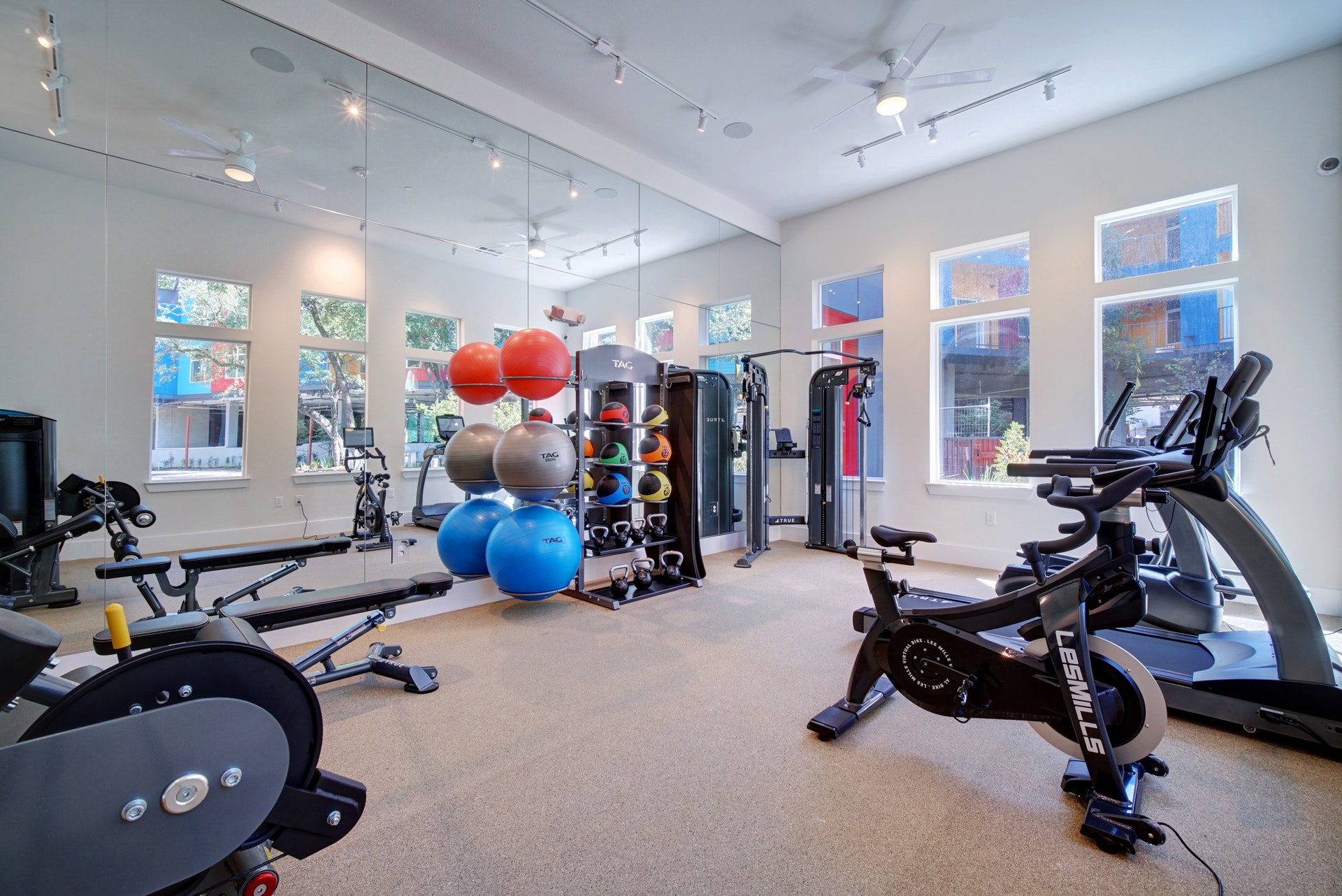 13130 Pond Springs Road, Unit 2203 Austin, TX 78729 - Photo 30 of 32 Workout area featuring a ceiling fan and a high ceiling