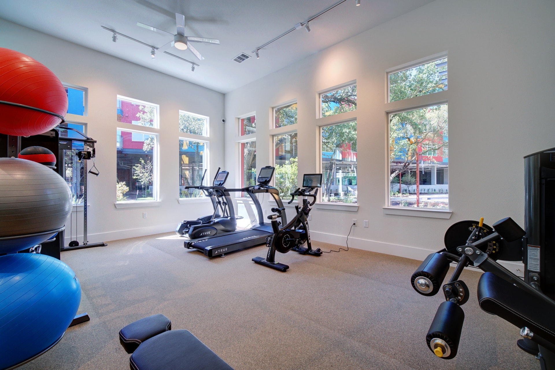 13130 Pond Springs Road, Unit 2203 Austin, TX 78729 - Photo 31 of 32 Exercise room with ceiling fan and a high ceiling