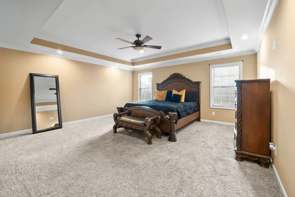 a bedroom with a bed and a flat tv screen