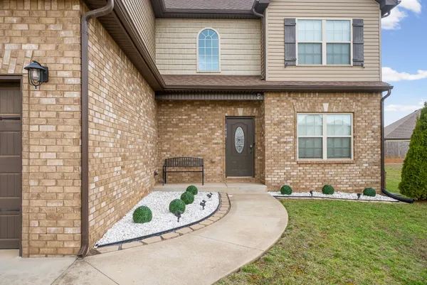 a front view of a house with a yard