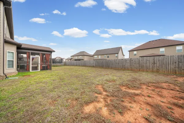 a view of a house with wooden floor and a yard
