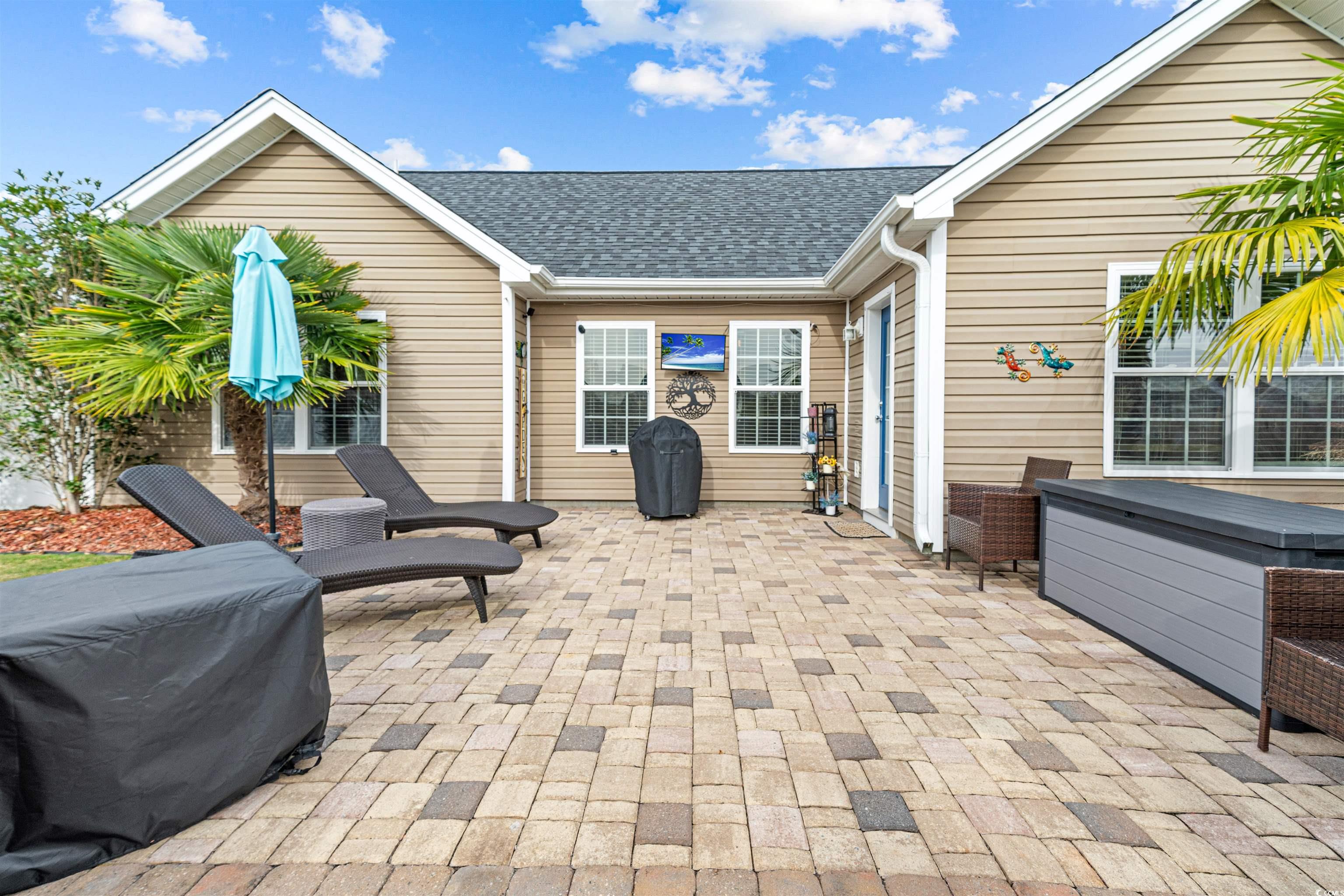 283 Beulah Circle Conway, SC 29527 - Photo 13 of 32 View of patio featuring a jacuzzi and a grill