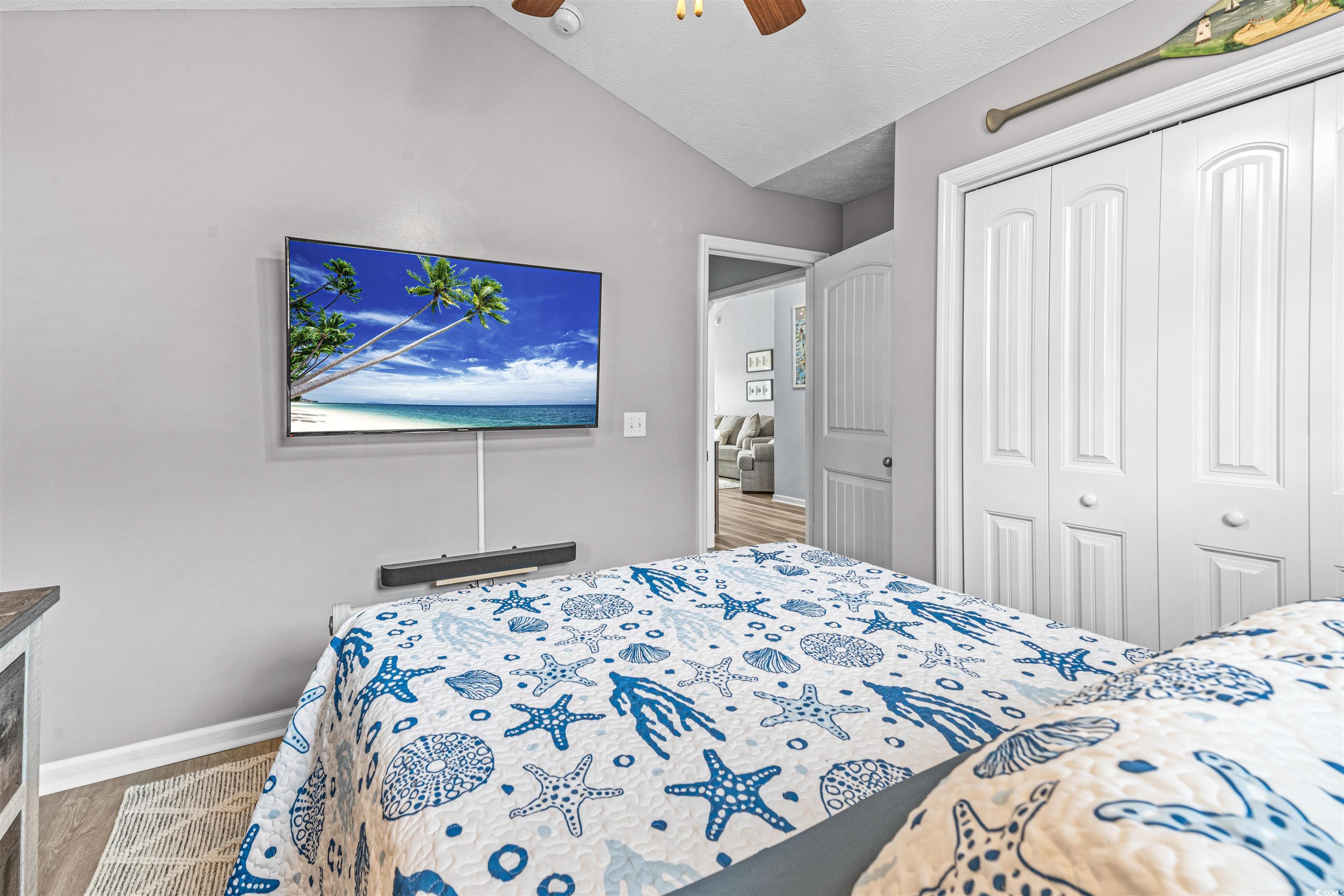 283 Beulah Circle Conway, SC 29527 - Photo 20 of 32 Bedroom with vaulted ceiling, a closet, ceiling fan, and wood finished floors