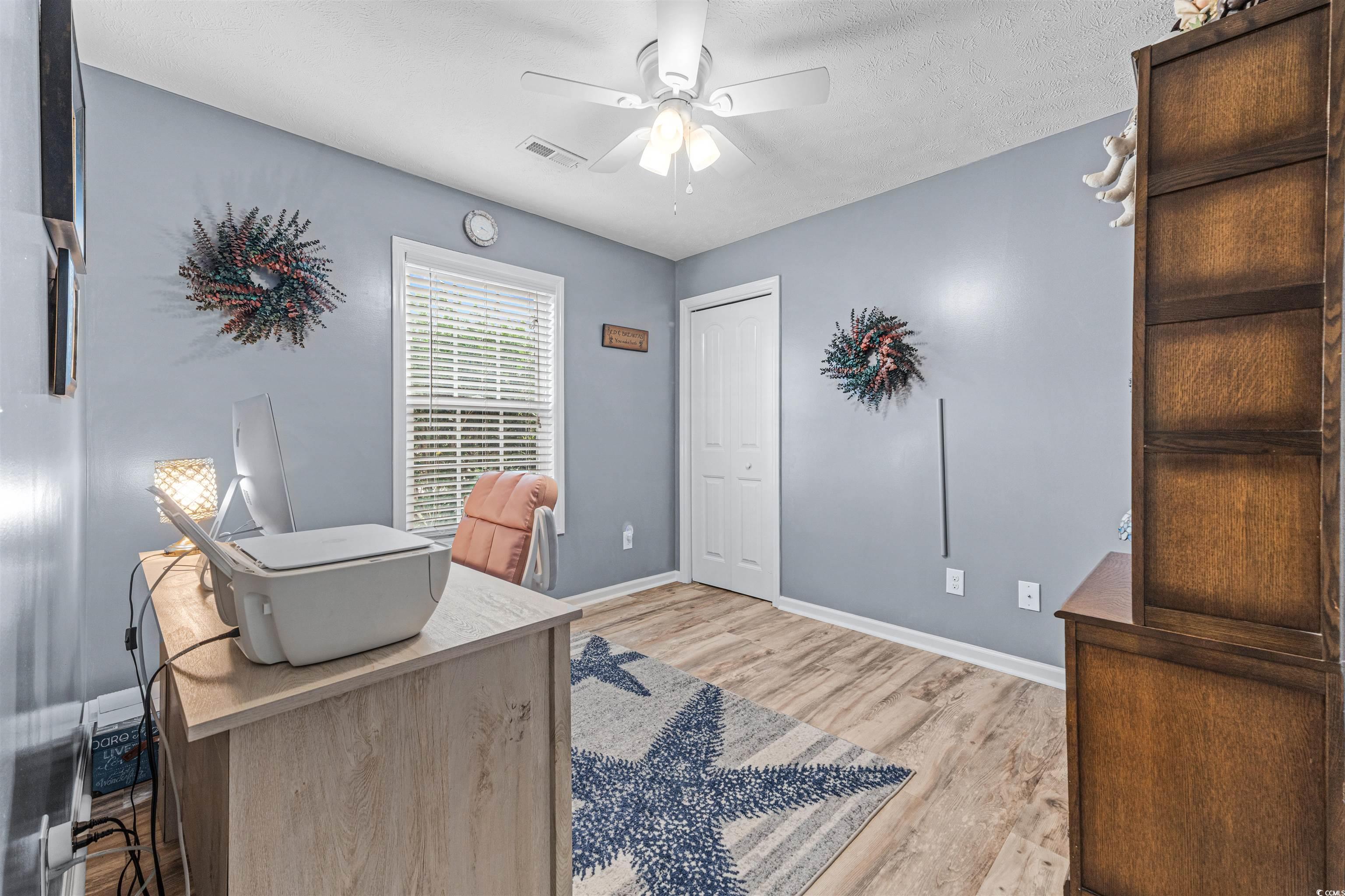 283 Beulah Circle Conway, SC 29527 - Photo 22 of 32 Office space with light wood-style floors, ceiling fan, and a textured ceiling