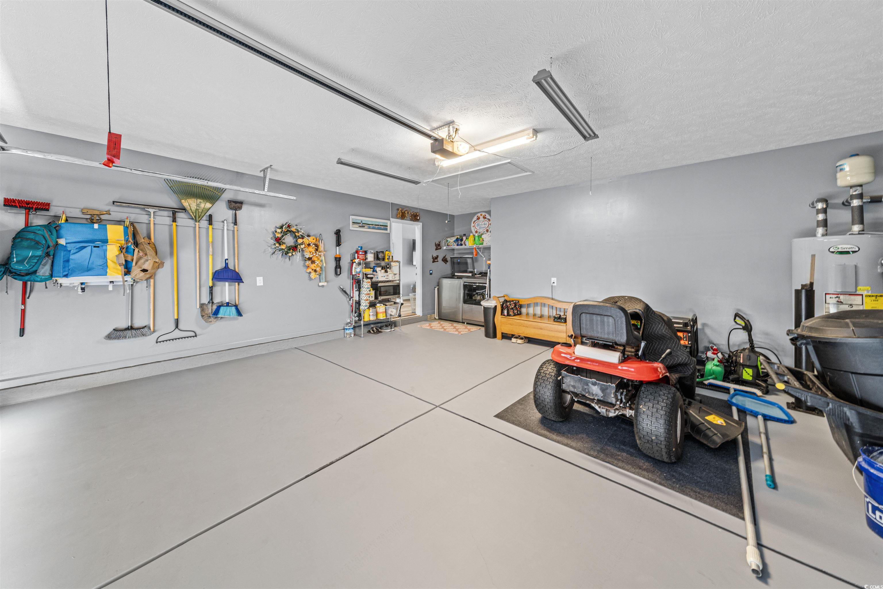 283 Beulah Circle Conway, SC 29527 - Photo 26 of 32 Garage with water heater and a garage door opener