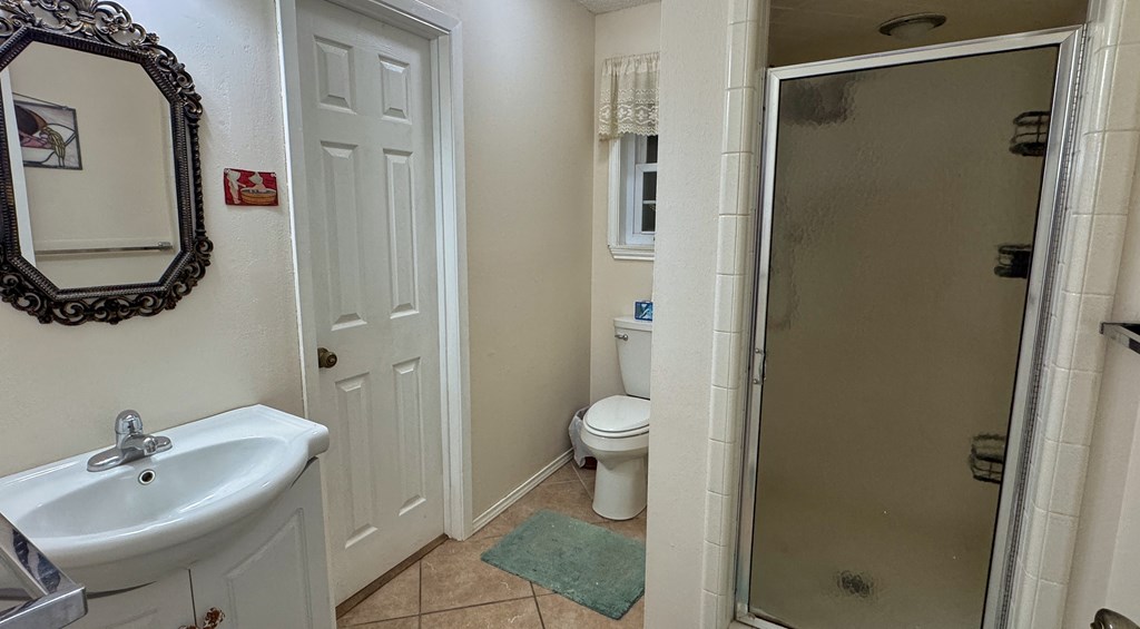 305 Rock Ridge Kerrville, TX 78028 - Photo 15 of 36 a bathroom with a sink and a mirror