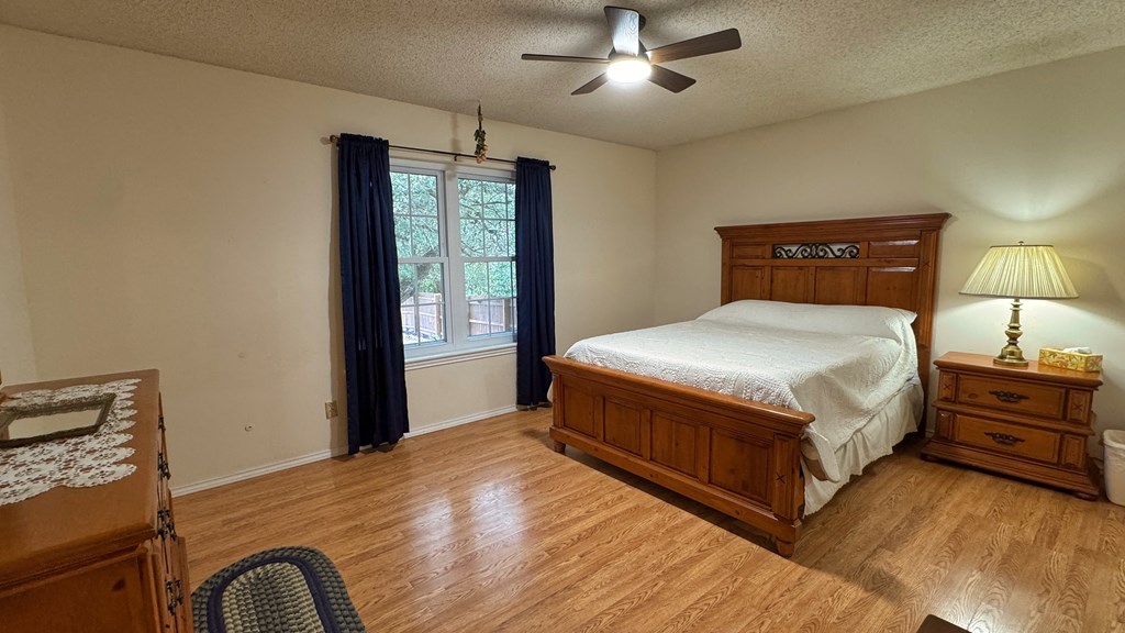 305 Rock Ridge Kerrville, TX 78028 - Photo 16 of 36 a bedroom with a bed and window