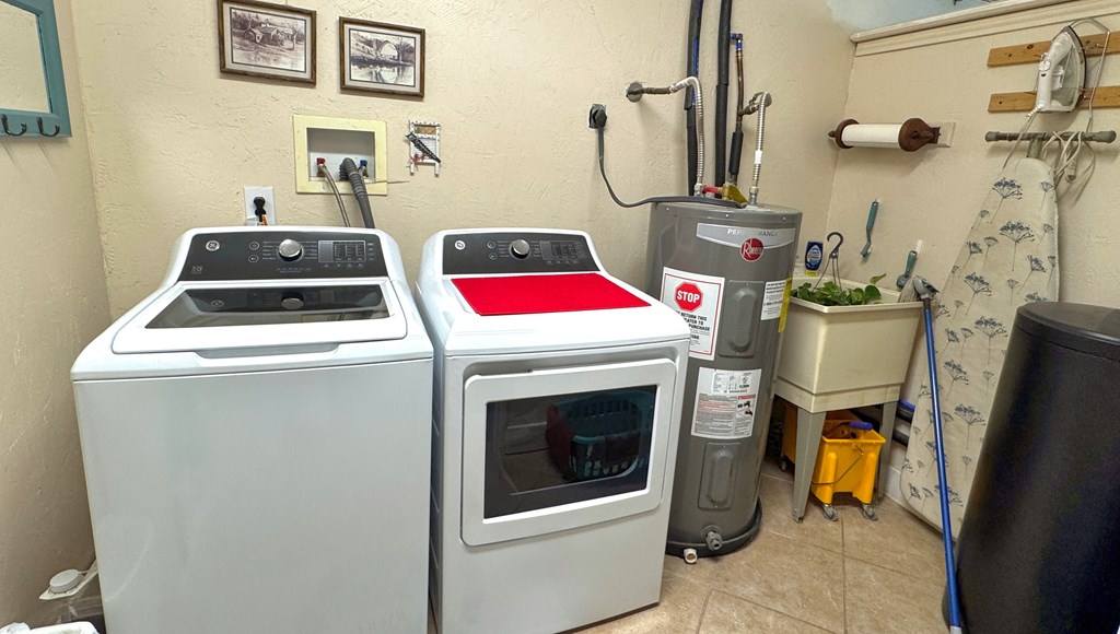 305 Rock Ridge Kerrville, TX 78028 - Photo 24 of 36 a utility room with dryer and washer
