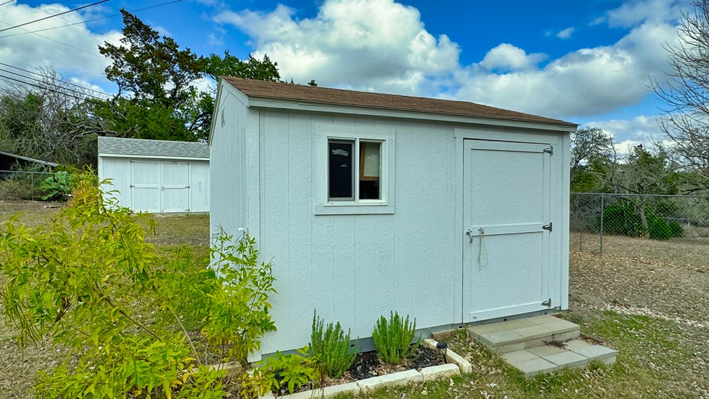 305 Rock Ridge Kerrville, TX 78028 - Photo 31 of 36 a front view of a house with garden