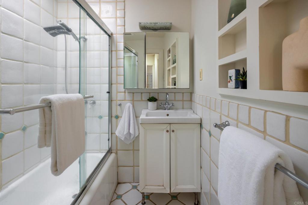 5416 Taft Avenue La Jolla, CA 92037 - Photo 15 of 23 a bathroom with a sink a vanity and shower
