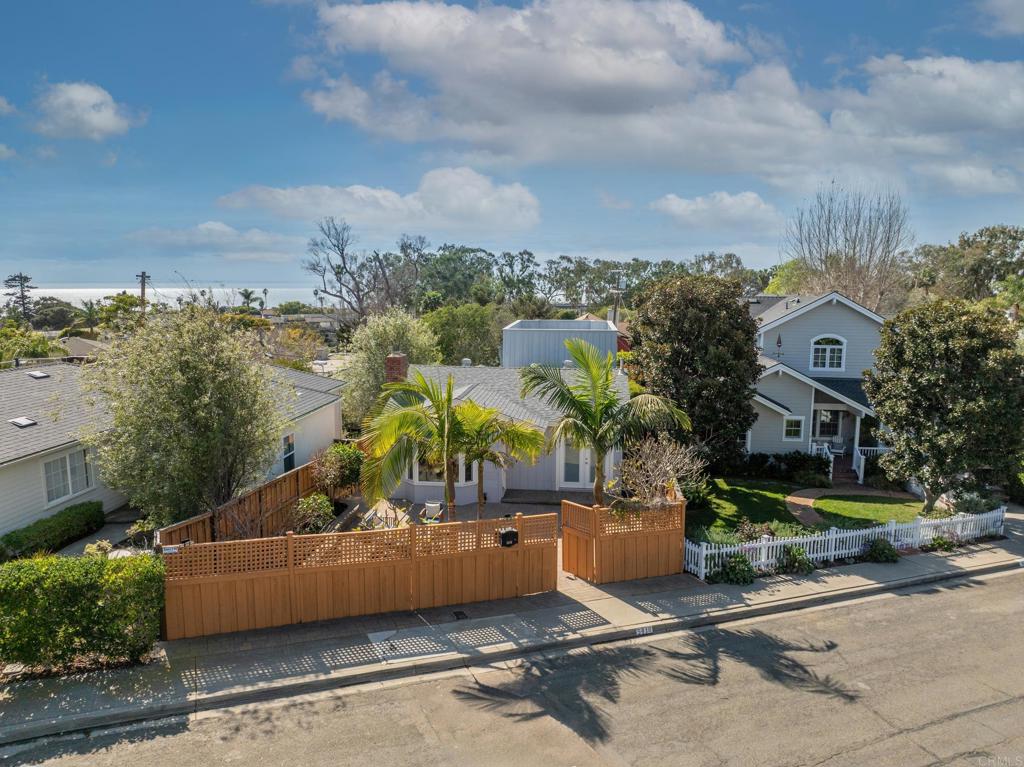 5416 Taft Avenue La Jolla, CA 92037 - Photo 2 of 23 an aerial view of a house with a garden and lake view