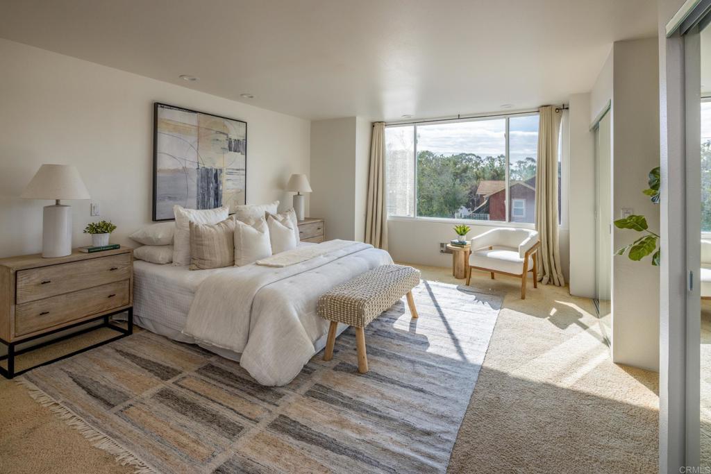 5416 Taft Avenue La Jolla, CA 92037 - Photo 8 of 23 a bedroom with a bed and a large window