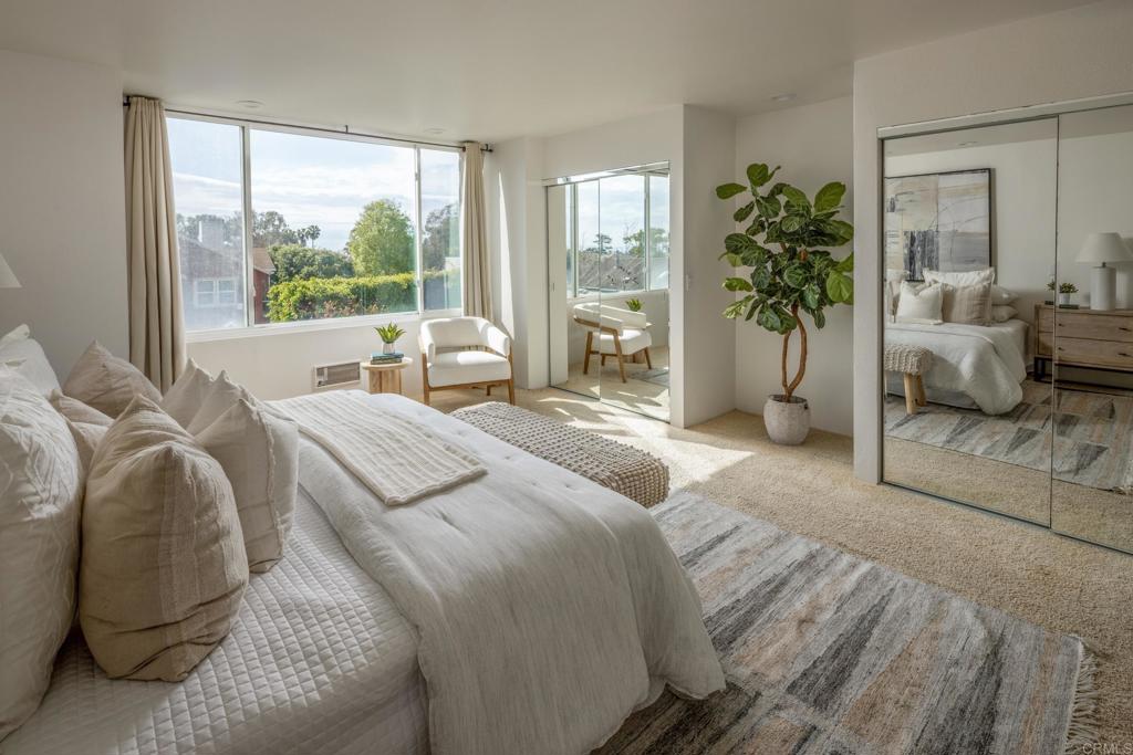 5416 Taft Avenue La Jolla, CA 92037 - Photo 9 of 23 a bedroom with bed and glass window