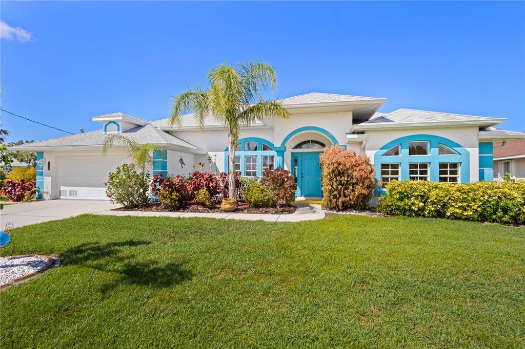 116 Tournament Road Rotonda West, FL 33947 - Photo 1 of 1 a front view of a house with garden
