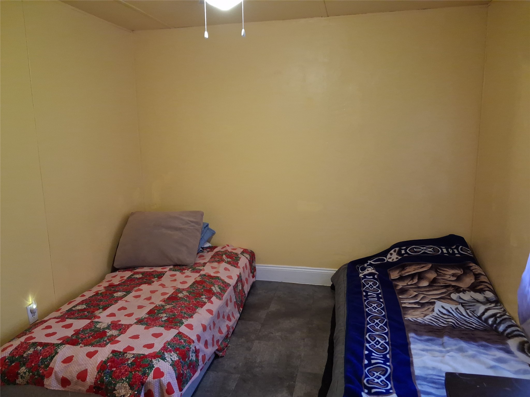 3646 Upper Leggett Road Livingston, TX 77351 - Photo 29 of 43 a bedroom with a bed and a lamp