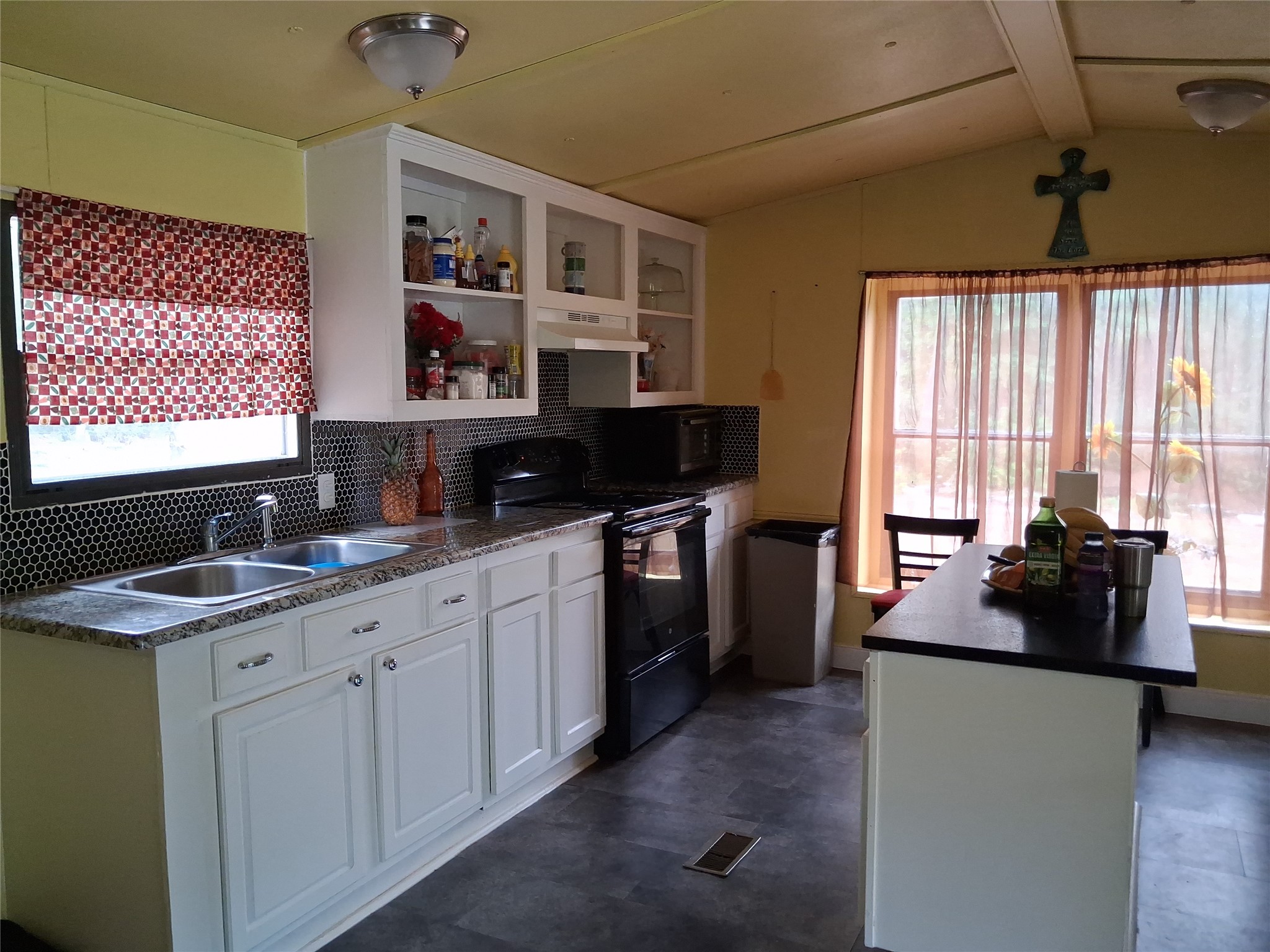 3646 Upper Leggett Road Livingston, TX 77351 - Photo 40 of 43 a kitchen with stainless steel appliances granite countertop a sink stove and refrigerator