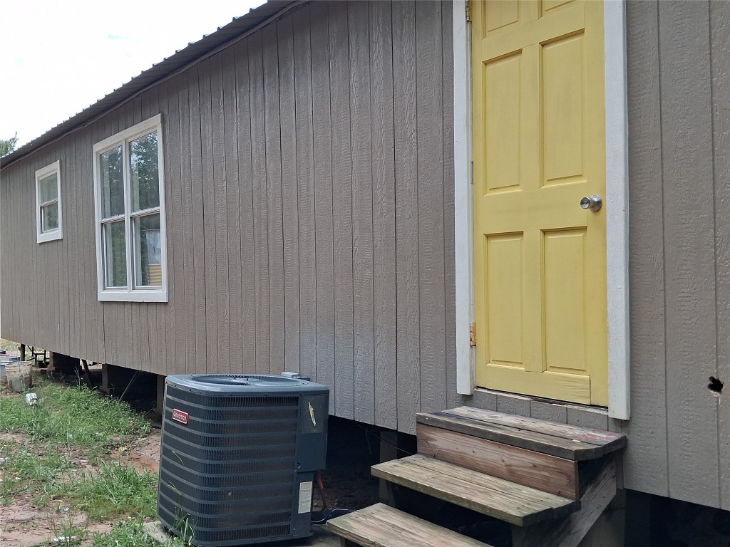 3646 Upper Leggett Road Livingston, TX 77351 - Photo 7 of 43 a view of wooden door and chair
