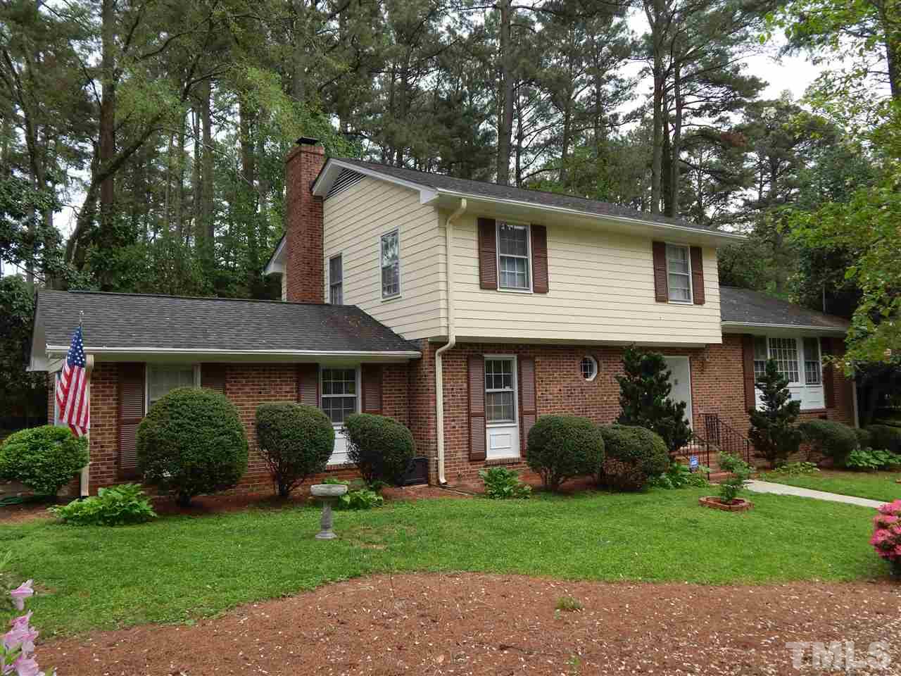 5304 Edgewood Road Raleigh, NC 27609 - Photo 2 of 25 a view of a house with a yard and plants