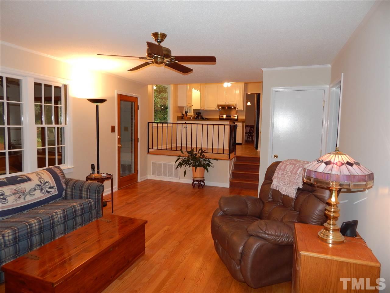 5304 Edgewood Road Raleigh, NC 27609 - Photo 13 of 25 a living room with furniture and a large window