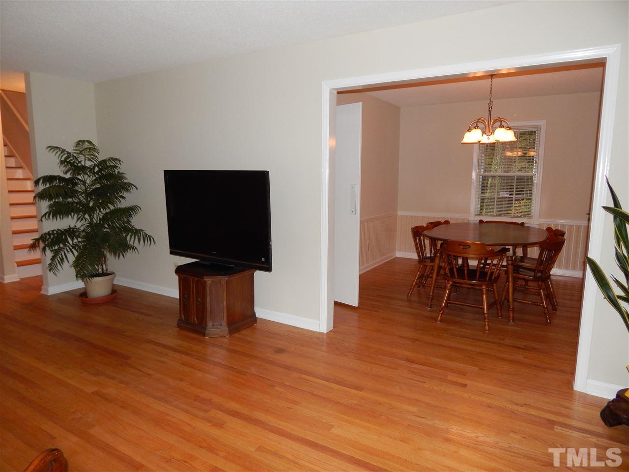5304 Edgewood Road Raleigh, NC 27609 - Photo 15 of 25 a view of a dining room with furniture window and wooden floor