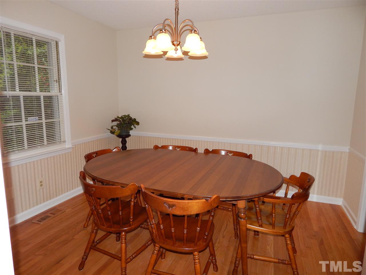 5304 Edgewood Road Raleigh, NC 27609 - Photo 17 of 25 a table and chairs in a room