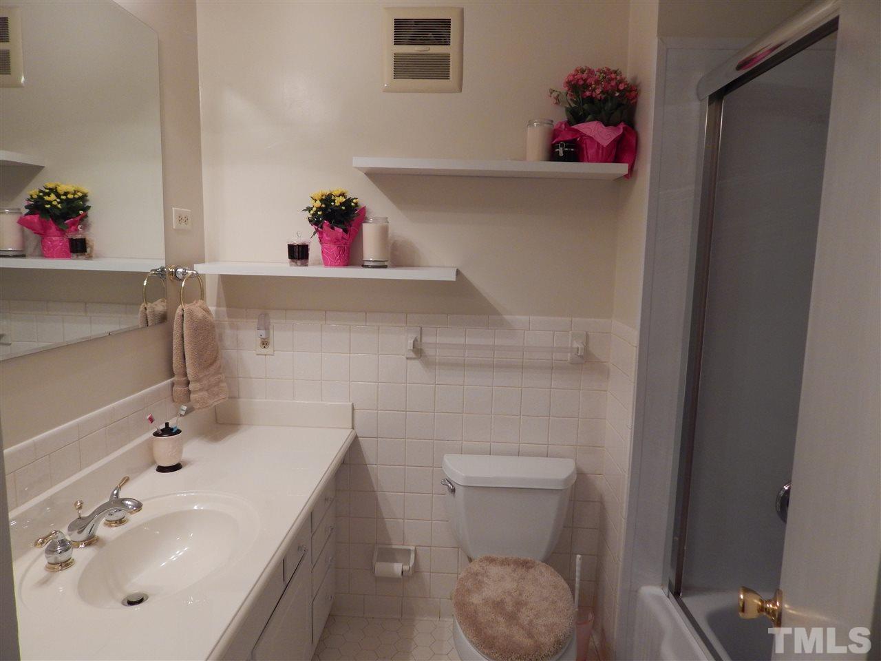 5304 Edgewood Road Raleigh, NC 27609 - Photo 20 of 25 a bathroom with a sink toilet and a mirror