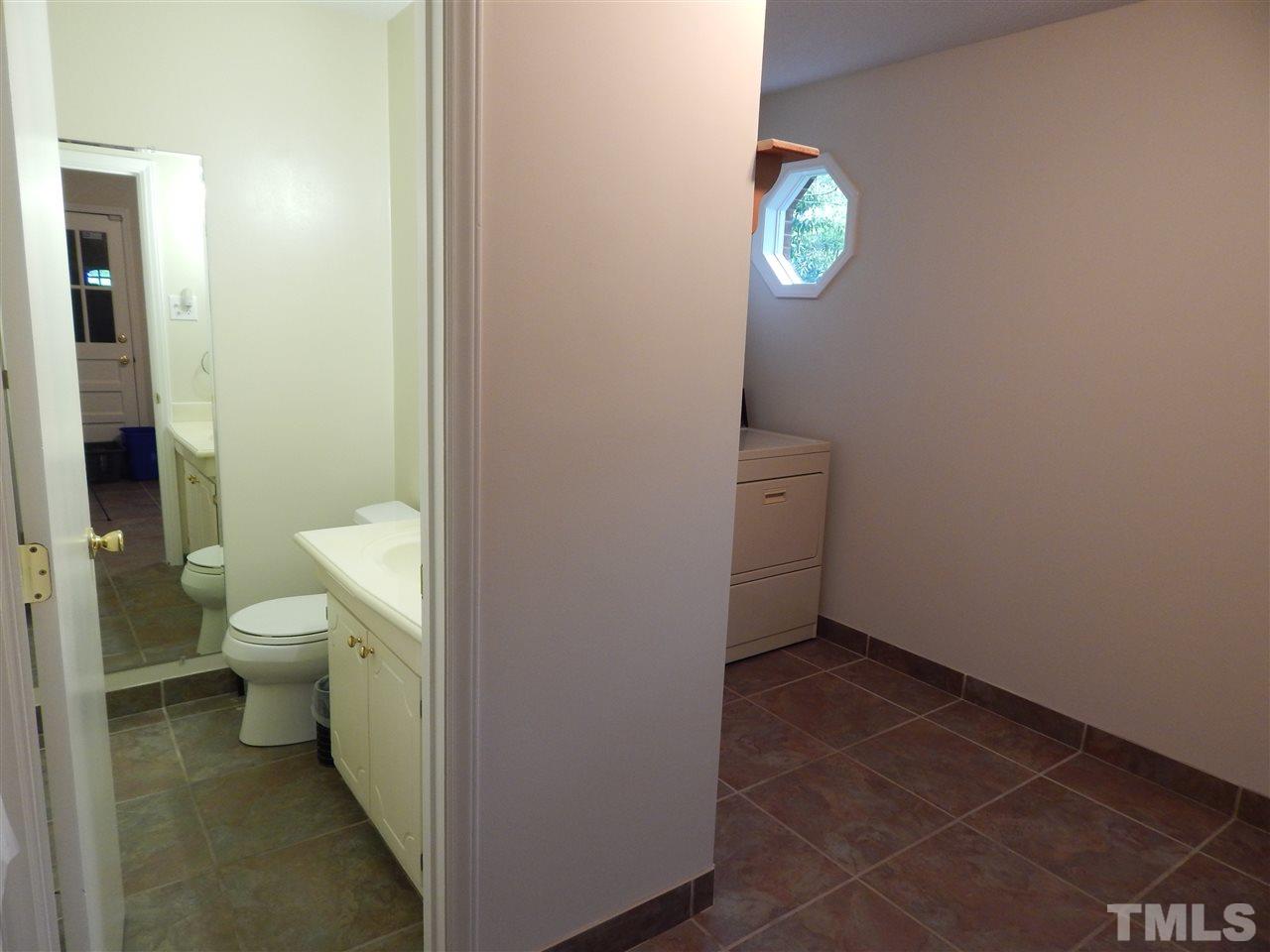 5304 Edgewood Road Raleigh, NC 27609 - Photo 22 of 25 a bathroom with a toilet and a shower