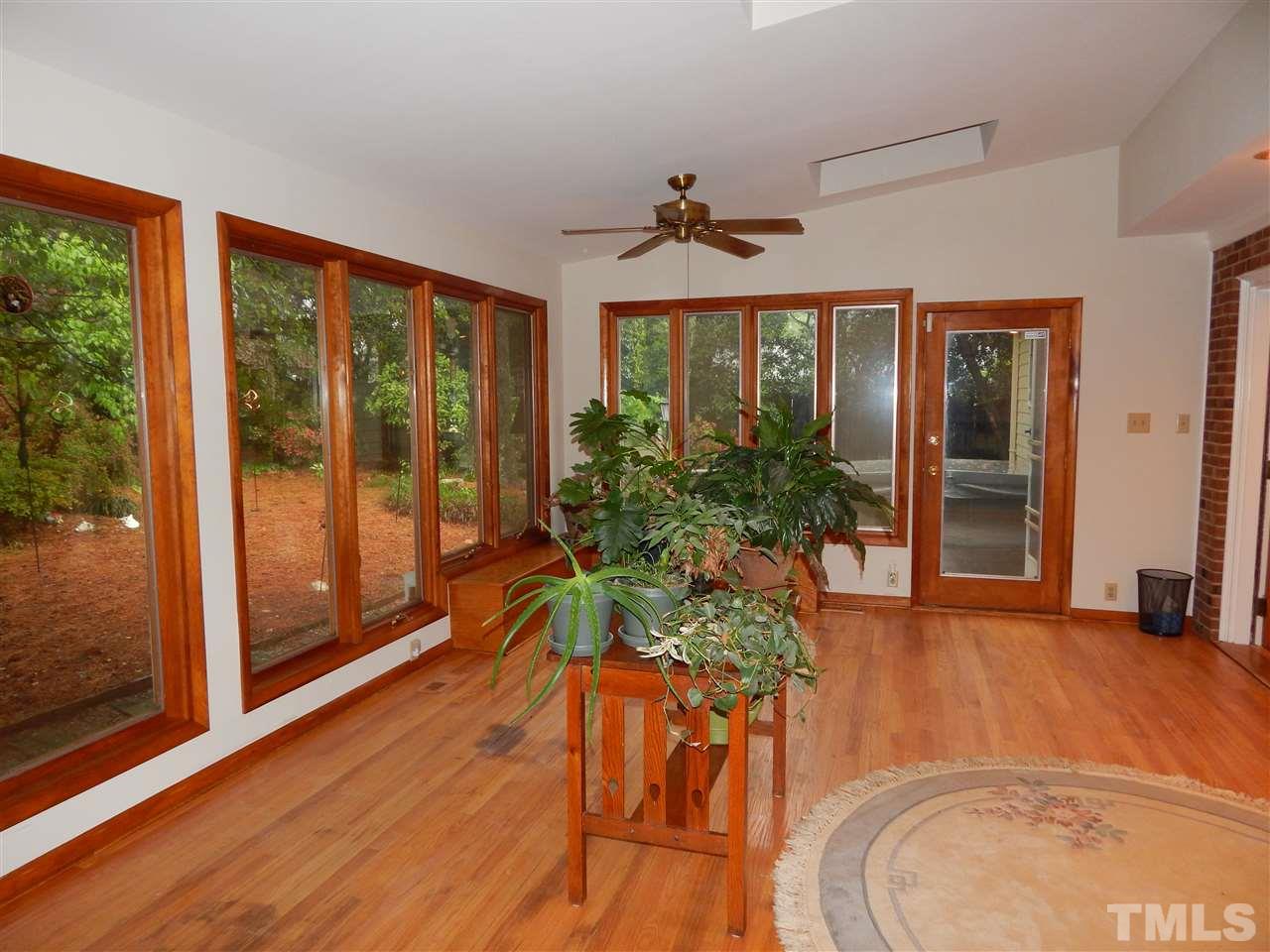 5304 Edgewood Road Raleigh, NC 27609 - Photo 10 of 25 a living room with a large window