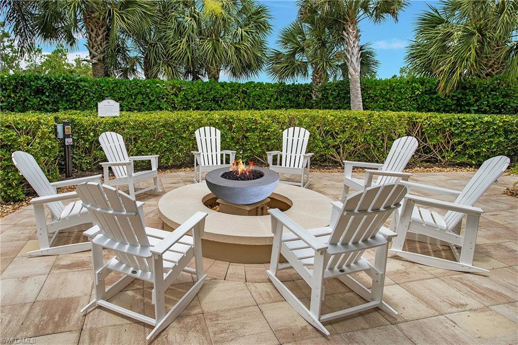 7674 Jacaranda Lane Naples, FL 34114 - Photo 43 of 45 a view of a patio with furniture and garden