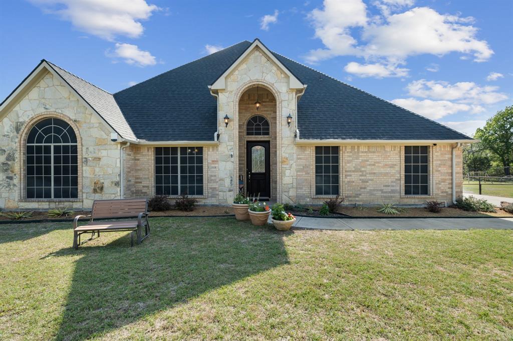 112 Waterfall Court Azle, TX 76020 - Photo 4 of 40 a view of a house with a yard