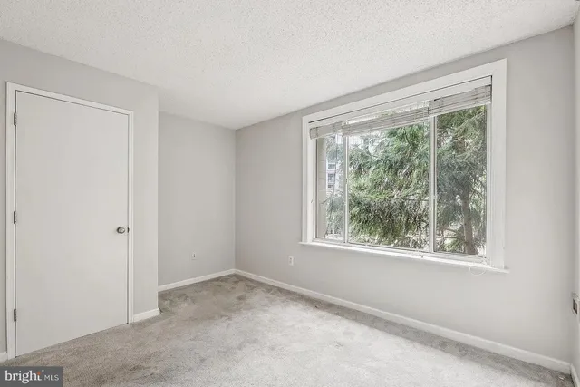 a view of a big room with window and an empty room